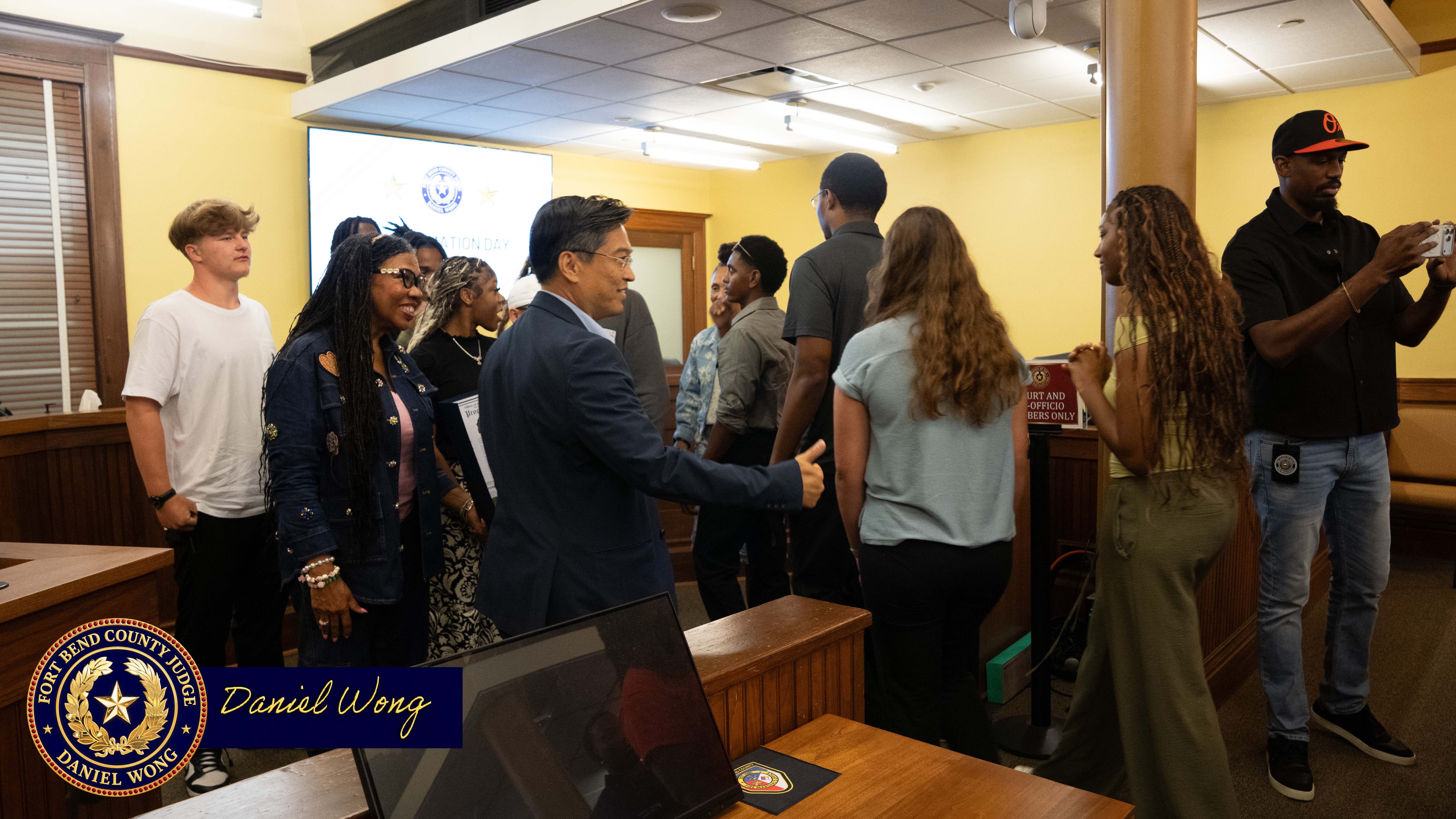 Judge Dainel Wong guiding inters for the Parks and Recreation for a group photo