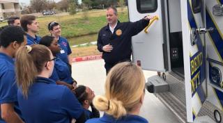 Chief Temple with EMT students at the Missouri City Campus