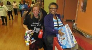 Line Dance Instructor and students donating toys.