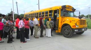 Patrons Boarding Bus to Ensemble Theatre