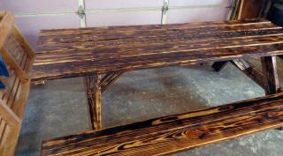 8' picnic table with attached benches with burnt finish and outdoor polylcoat