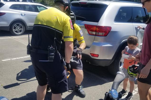Bike Team at Brazos State Park Photo 4 LT Ray and Paramedic Wynslow assisting with a youngster's bike