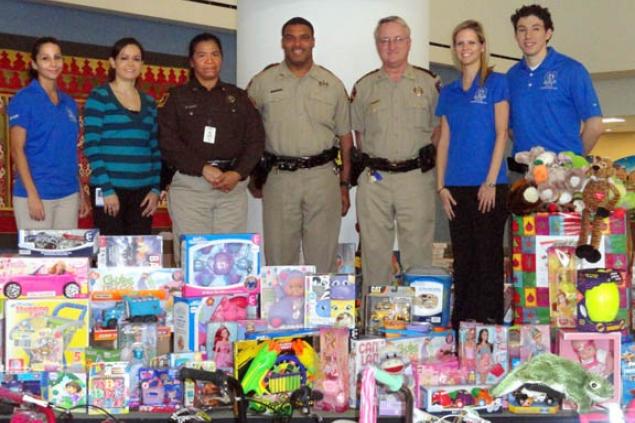 Pictured from L to R: Ludivina Grace, Ana Mullins, Deputy Domitila Guerra, Deputy Frank Davis, Lt. Lester Phipps, Kristel Varnell, and Julio Corona.