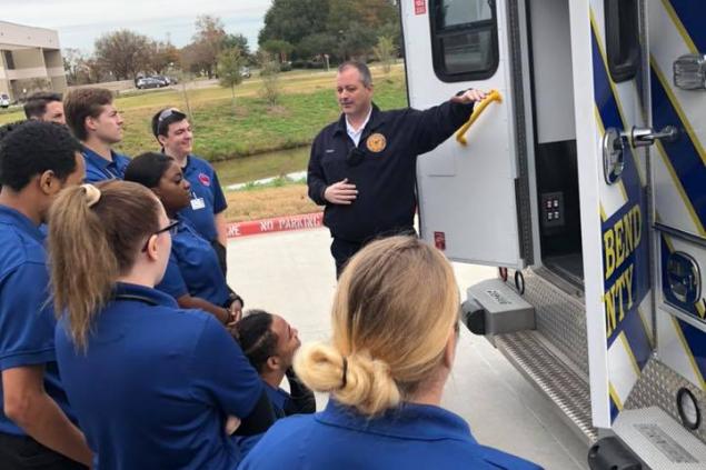 Chief Temple with EMT students at the Missouri City Campus Chief Temple with EMT students at the Missouri City Campus