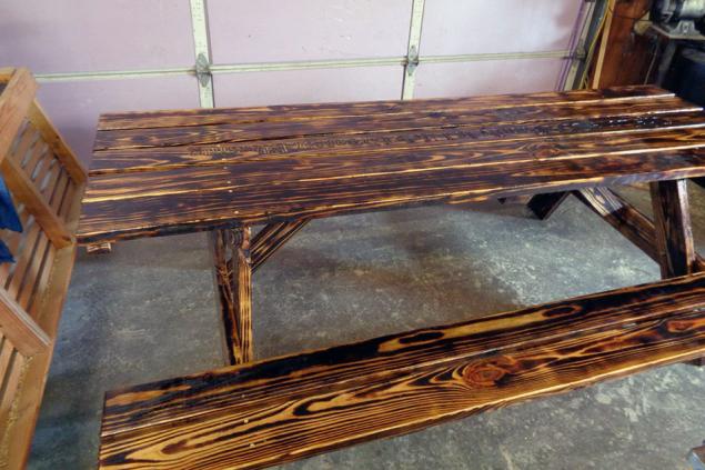 8' picnic table with attached benches with burnt finish and outdoor polylcoat